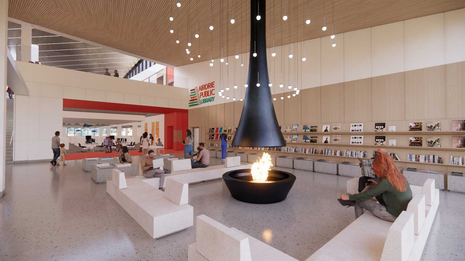 Building lobby, people sitting next to fireplace in foreground, bookshelves and library entrance in background.