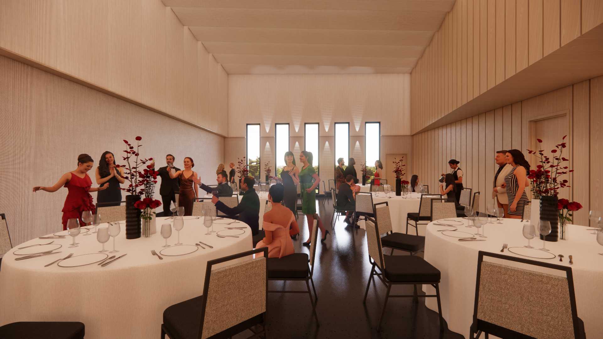 A large room with round tables set for formal dinner, people standing and sitting while talking.